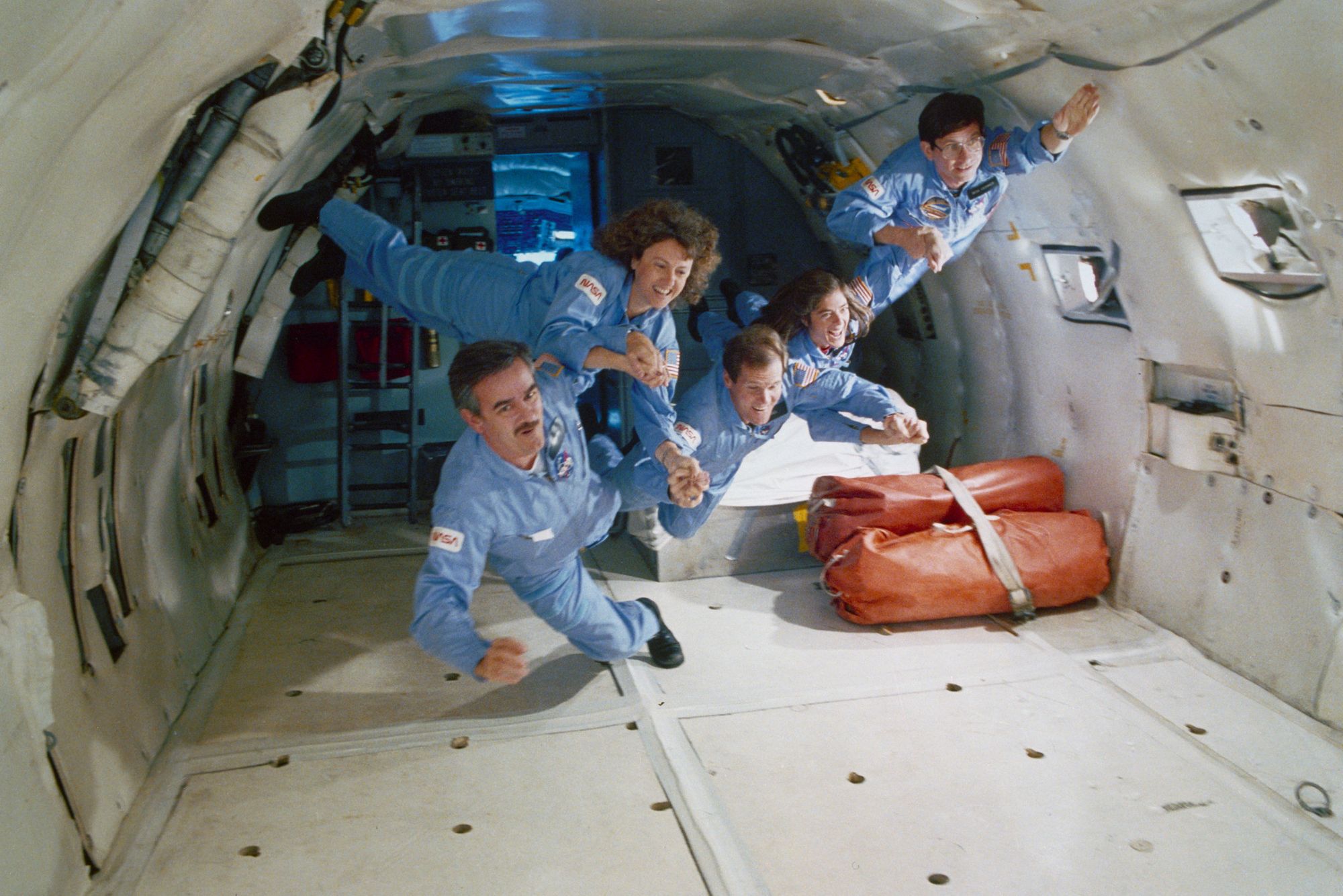 Astronaut/Teacher Christa McAuliffe (center) and Crew Mates Training on NASA's KSC-135 ("The Vomit Comet"), November 20, 1995 [Credit: NASA]